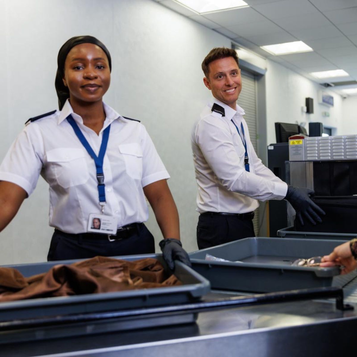 Two airport security staff