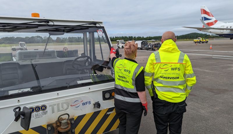 WFS staff looking at aircraft on ramp