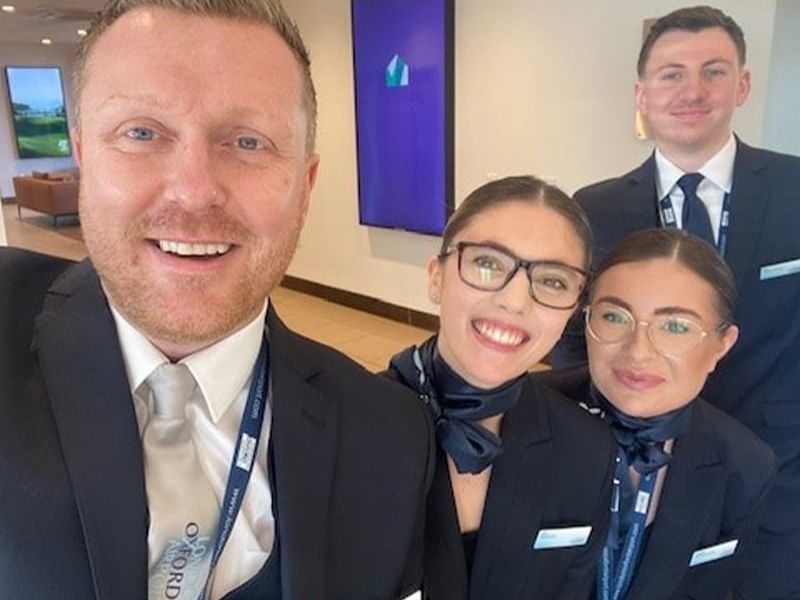 Staff at London Oxford Airport in new uniform - 2 men, 2 ladies - selfie style