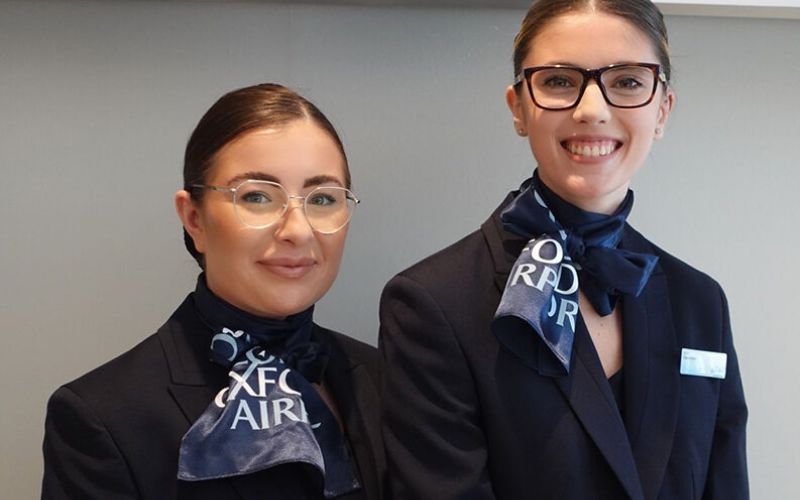 Two ladies on London Oxford airport uniform