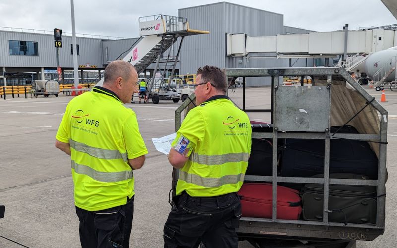 2 WFS staff discussing schedule