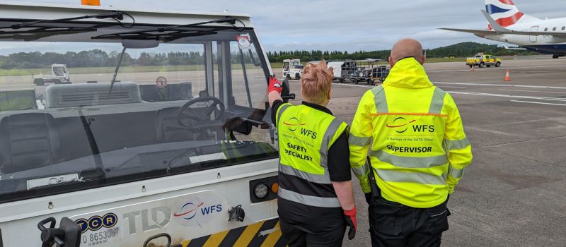 WFS staff looking at aircraft on ramp